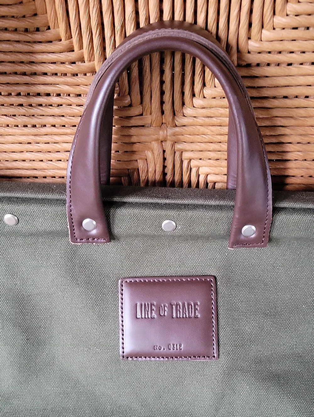 Line of Trade green military duffle sack with brown canvas strap